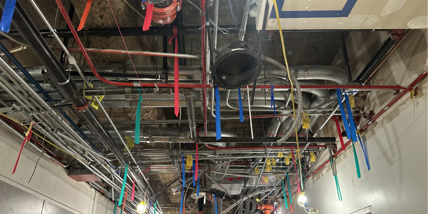 Different colored tape hanging from the ceiling.