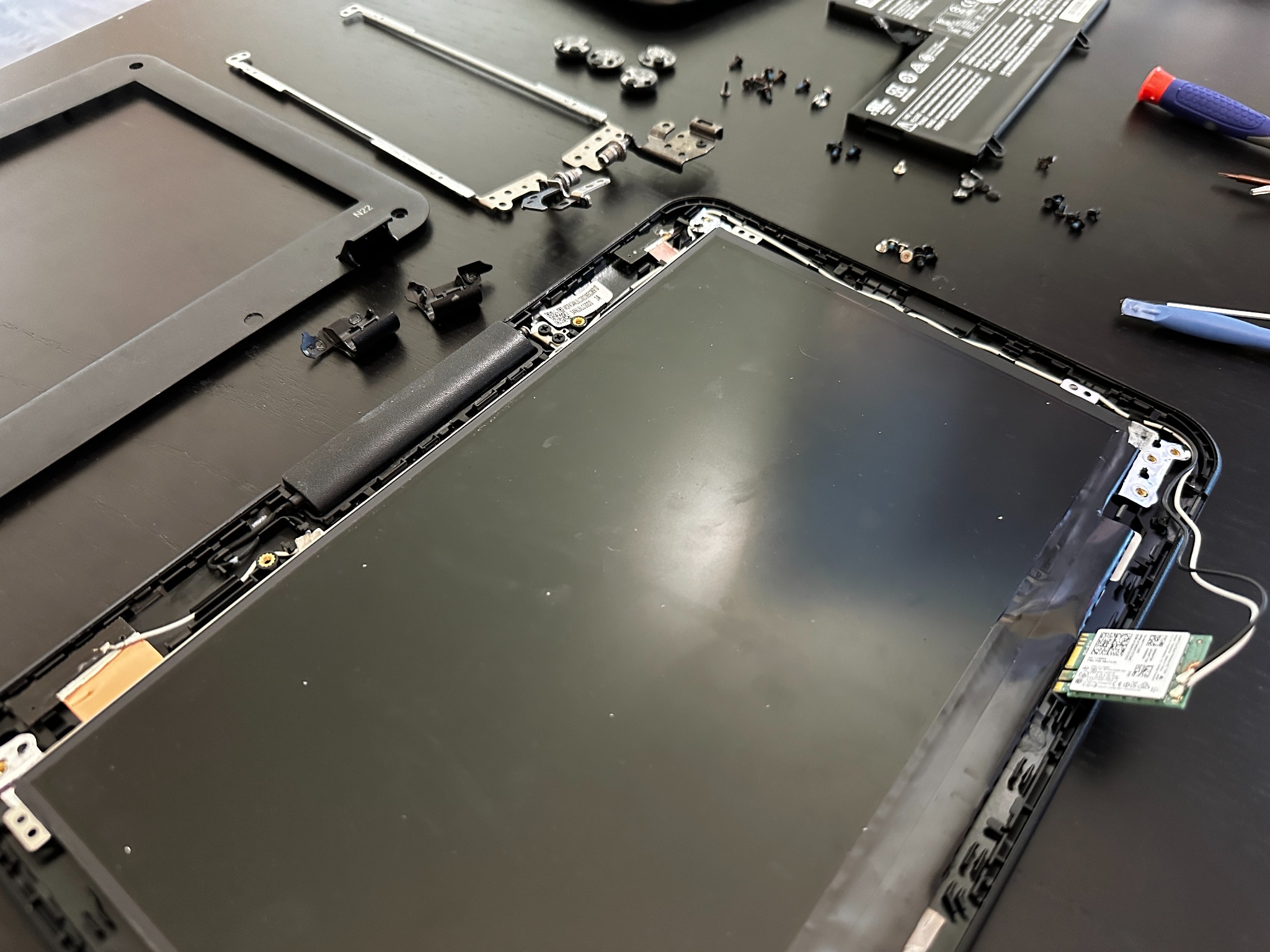 Lid hardware laid out showing parts that can be removed