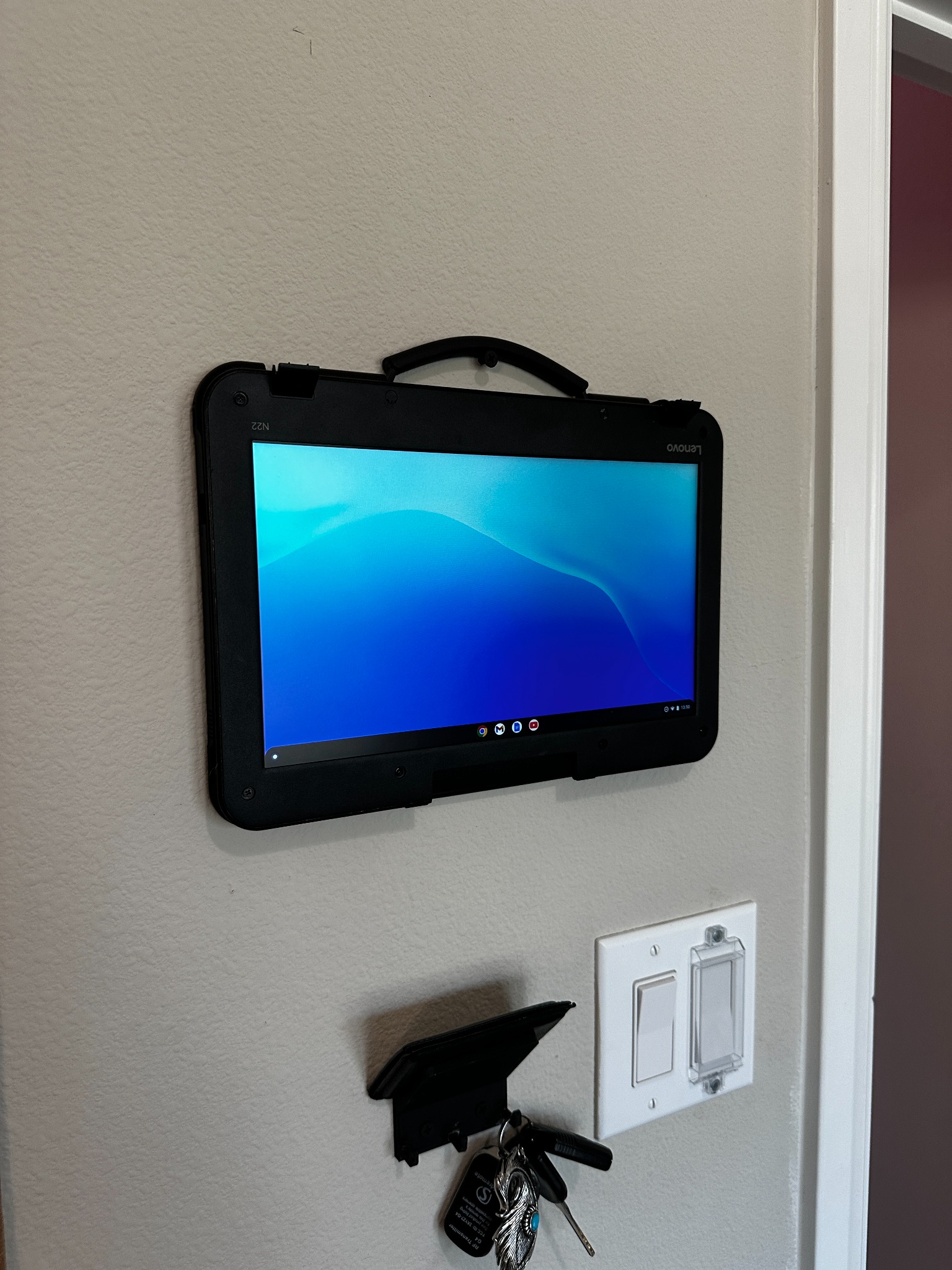 Close-up view of the wall-mounted Chromebook display showing flush mounting