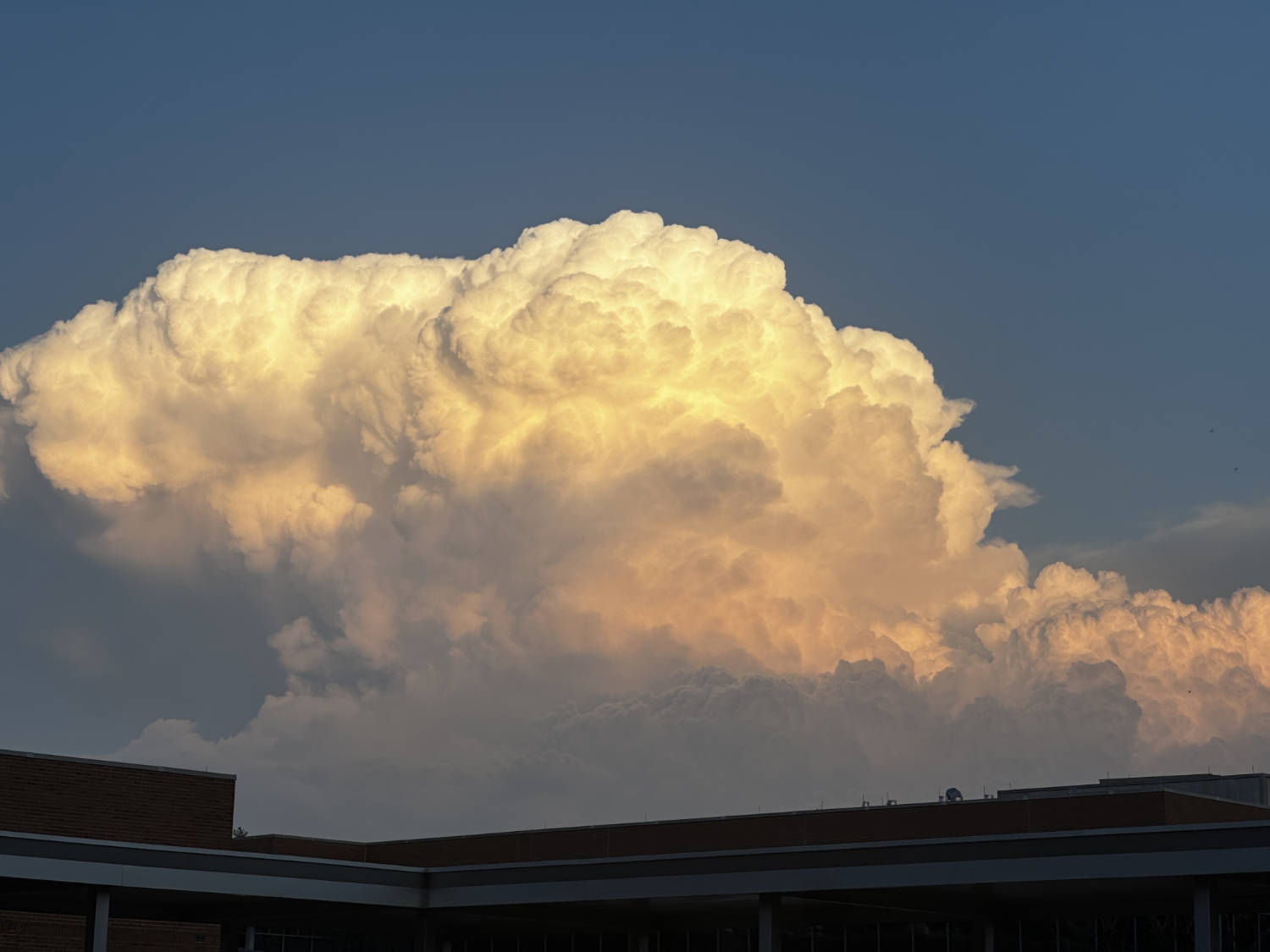 A large white and light orange cloud