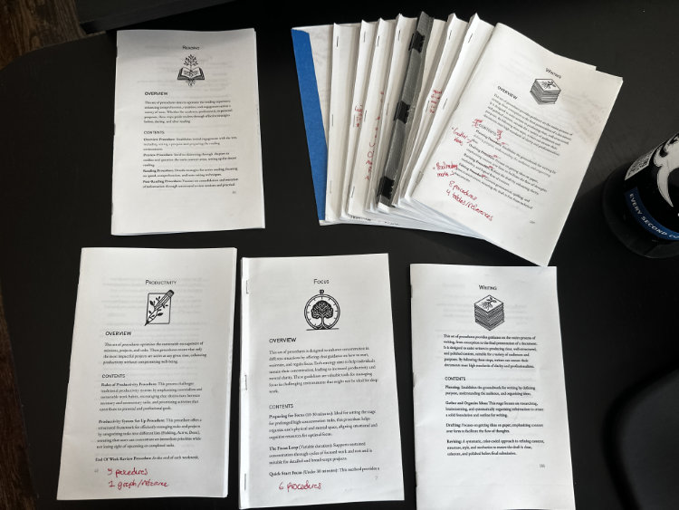 Many paper booklet drafts of The Mental Toolbox In progress