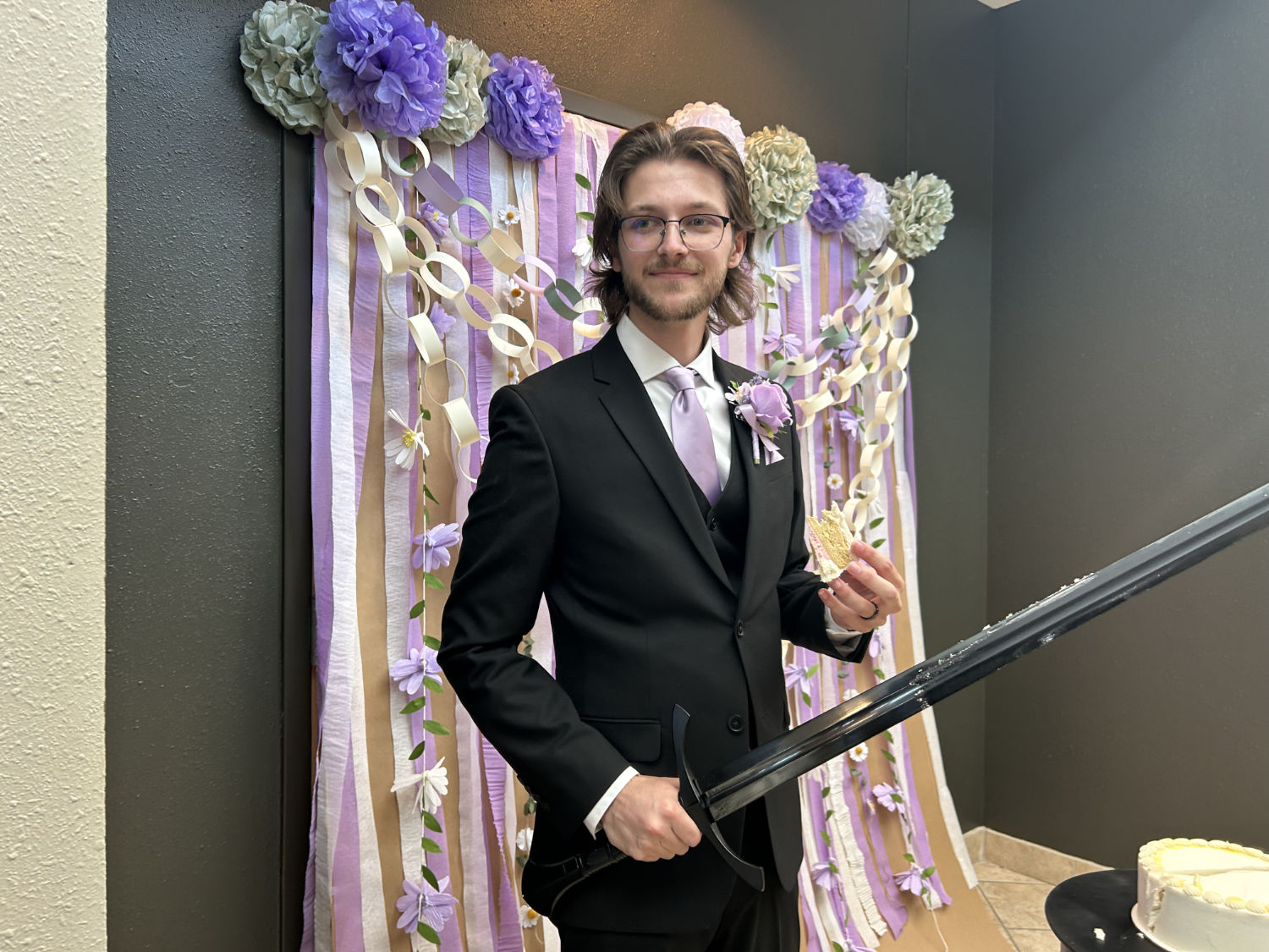 Holding a sword to cut the wedding cake